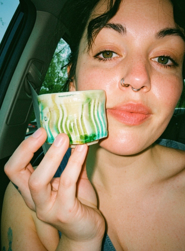 Person holding mug
